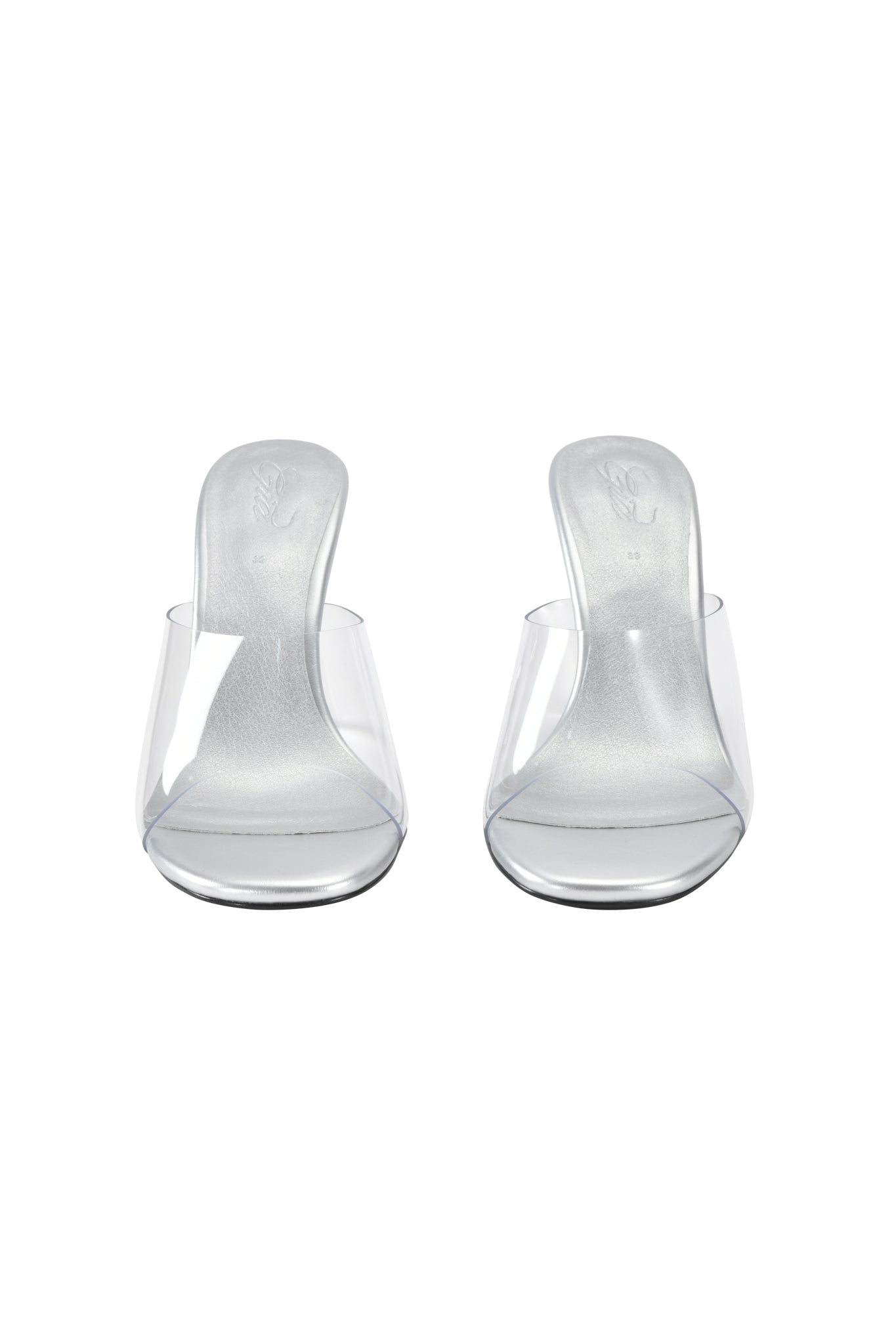 The I.AM.GIA RHEA CLEAR WEDGE HEEL features transparent wedge heels and clear vinyl straps, shown side by side on a white background.