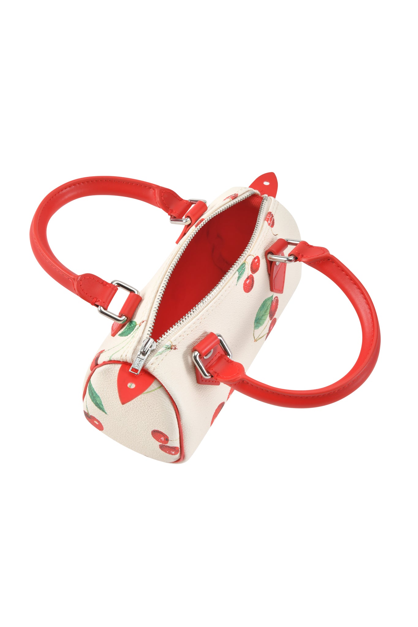 The I.AM.GIA NIKA MINI BAG - CHERRY ON TOP is a cream mini barrel purse with red cherries and green leaves, bold red handles, silver zipper hardware, and an open top showing its stylish interior.