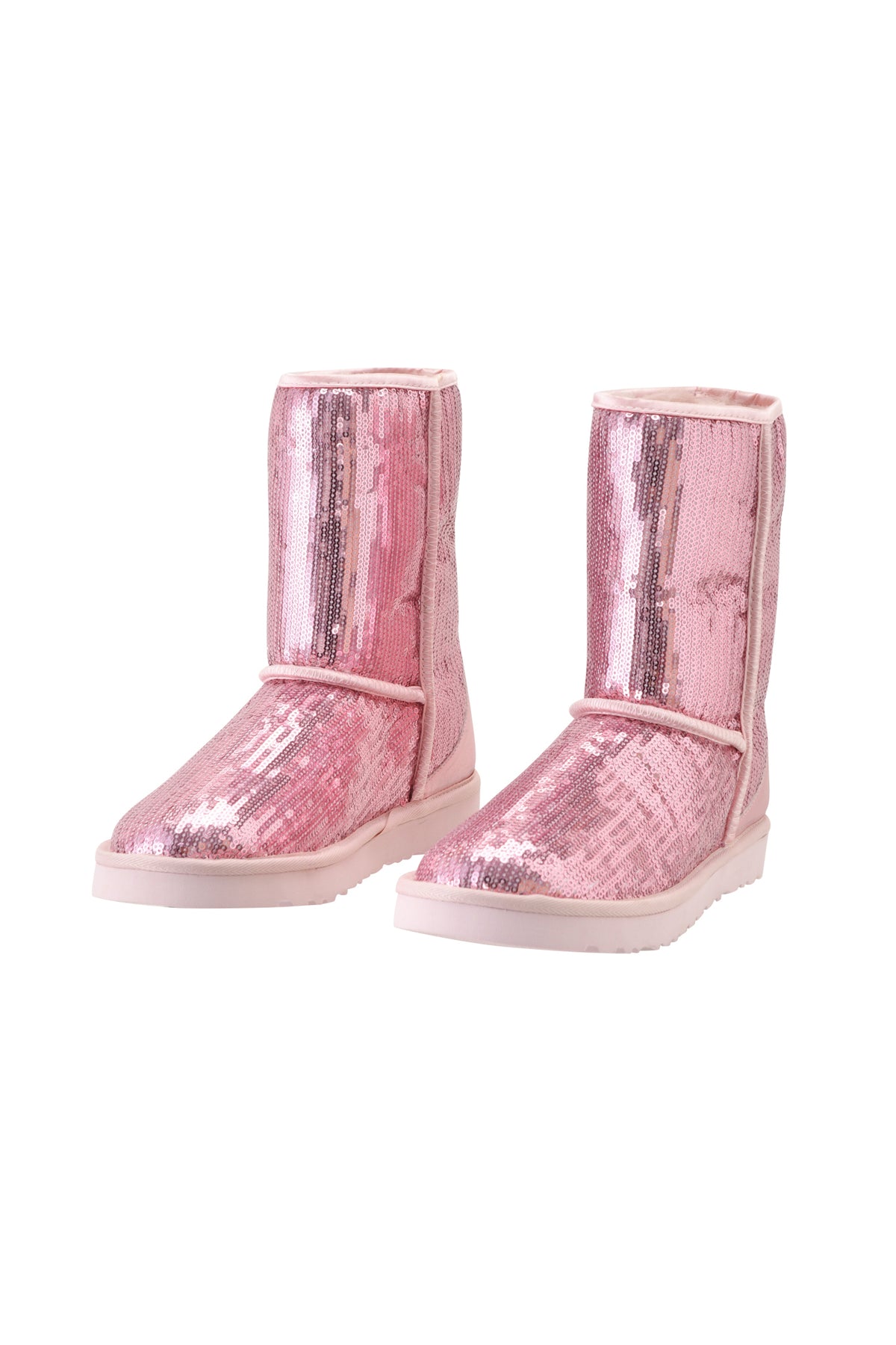 The ELVIRA SEQUIN BOOT - PINK by I.AM.GIA is a pair of mid-calf boots covered in shiny pink sequins, featuring flat white soles and light pink trim, displayed against a plain white background.