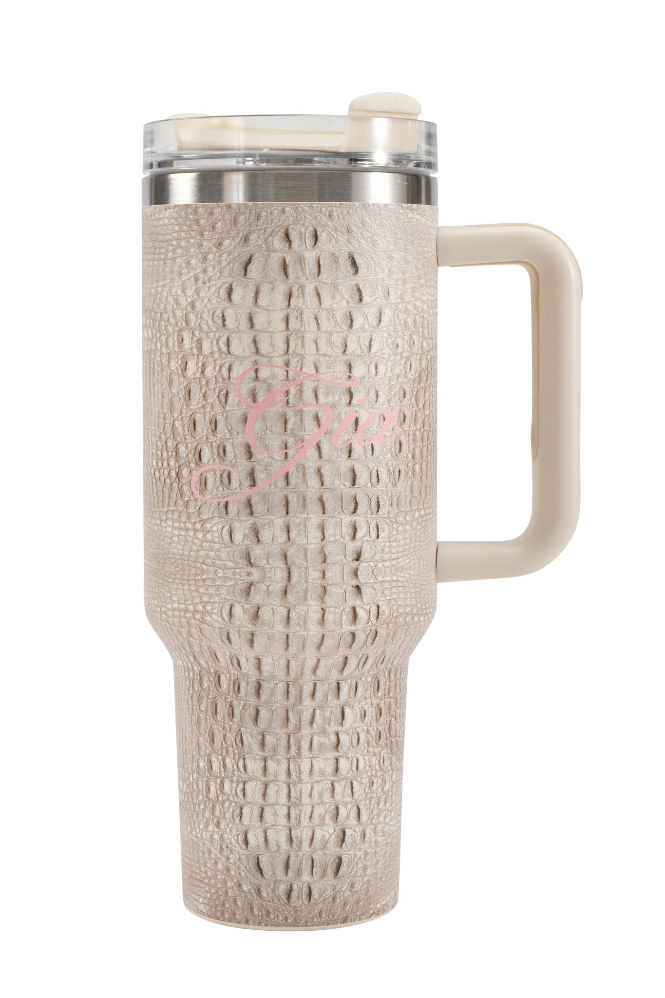 The BLARE CUP - HOT CROC by I.AM.GIA is a 40oz beige insulated stainless steel tumbler adorned with a bold crocodile skin pattern. It features a spacious handle for comfortable carrying, a clear slider lid, and a subtle pink cursive “G” elegantly displayed on the side.
