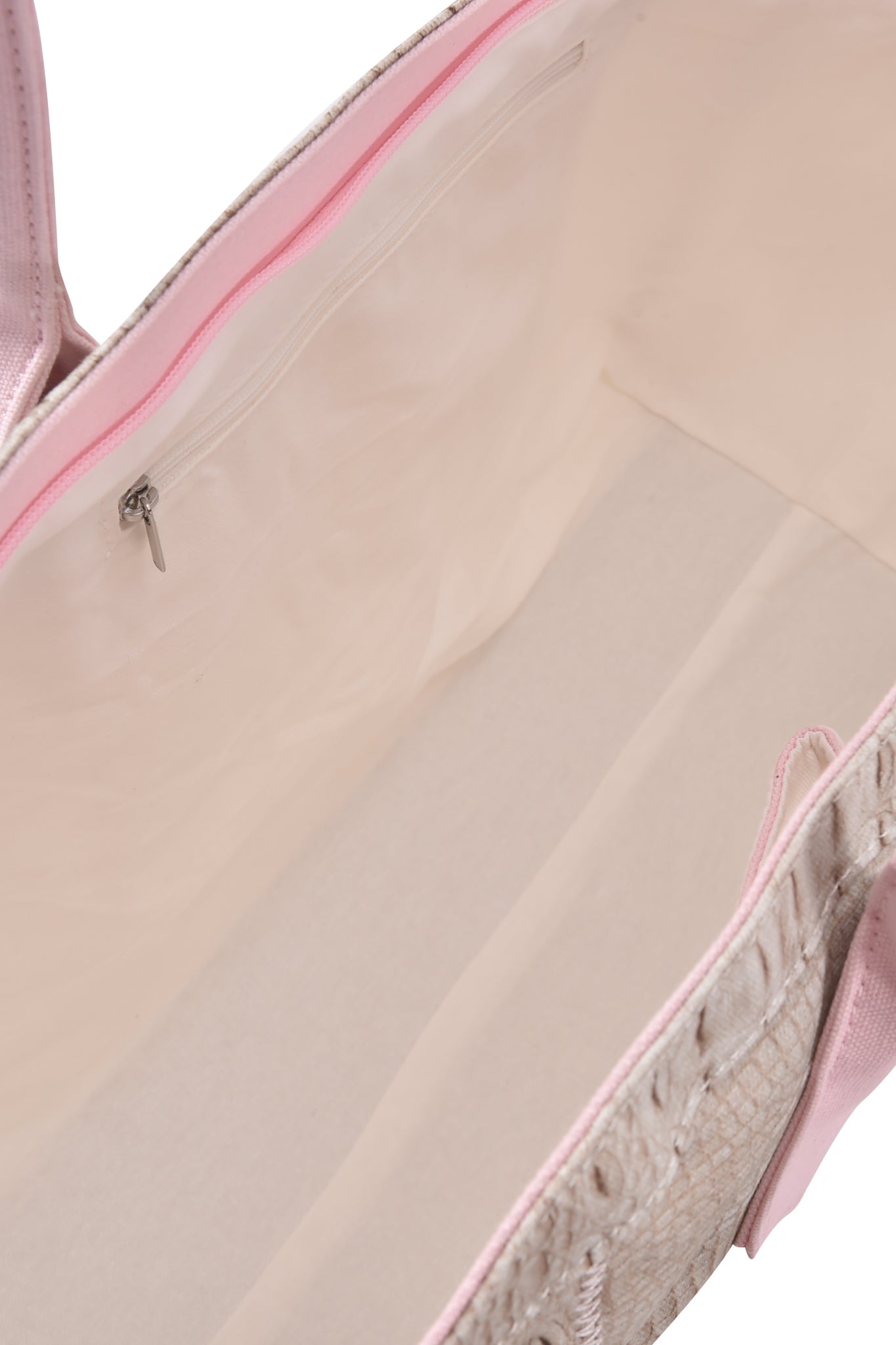 Open view of the BLARE TOTE BAG - HOT CROC by I.AM.GIA in light pink crocodile print, showcasing its spacious interior with a zippered pocket on the inner side and a smooth, cream-colored lining.