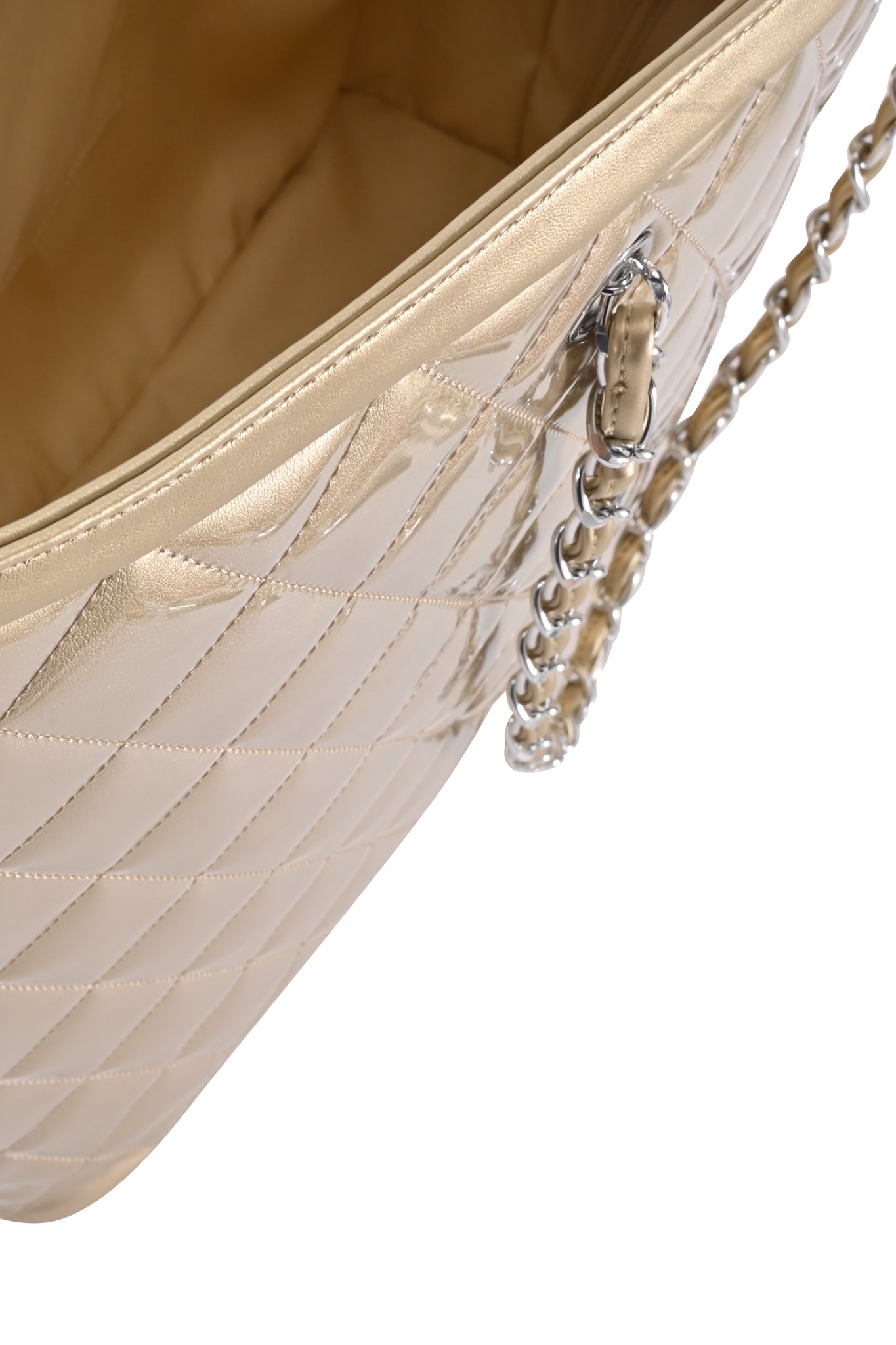 Close-up of the I.AM.GIA DANNI TOTE BAG - GOLD, featuring beige quilted texture, detailed stitching, a metallic chain strap, and a tan interior.