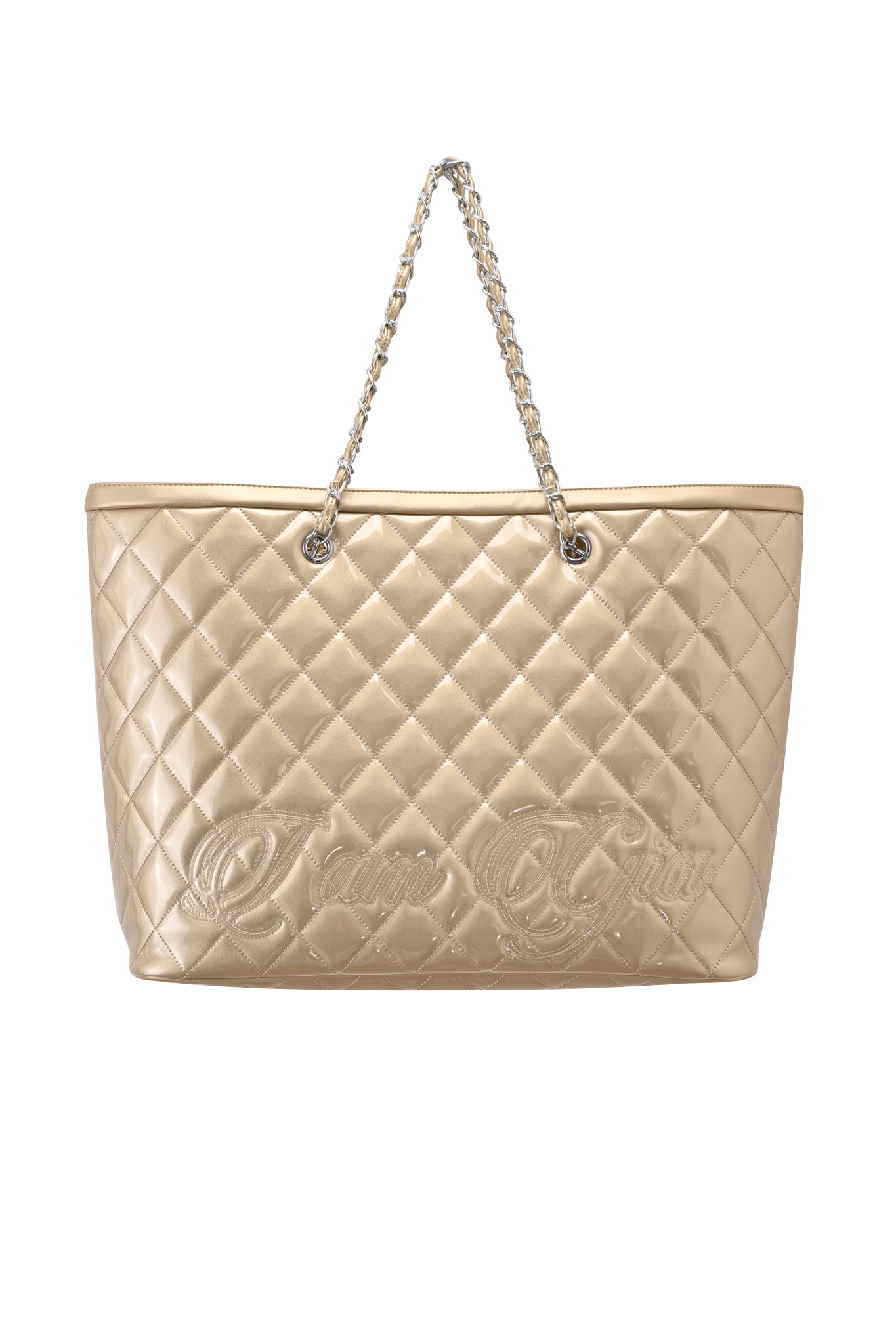 The DANNI TOTE BAG - GOLD by I.AM.GIA is a chic metallic gold quilted handbag featuring a chain strap and embossed script on the front, shown against a white background.
