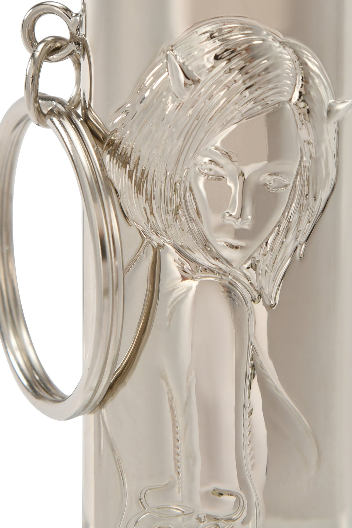 The T-REX LIGHTER CASE - SILVER by I.AM.GIA features a 3D embossed woman’s face with horn details—it’s a unique silver metal lighter holder and statement accessory.
