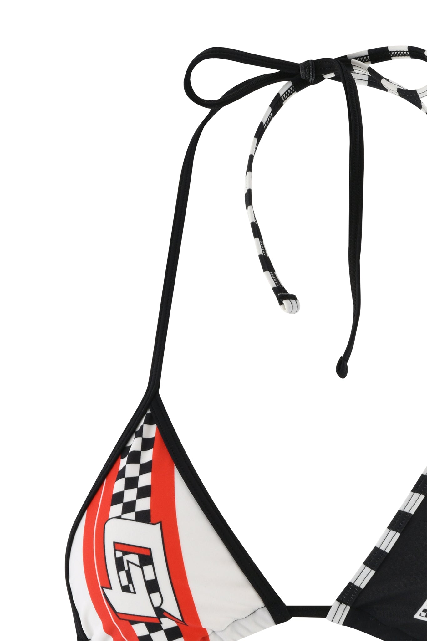 Close-up of the RHIANNE BIKINI TOP - BLACK from I.AM.GIA with a black strap. The fabric features a vibrant design in red, white, and black with checkered patterns and a graphic resembling the letter "G." Only part of this stylish bikini top is visible.