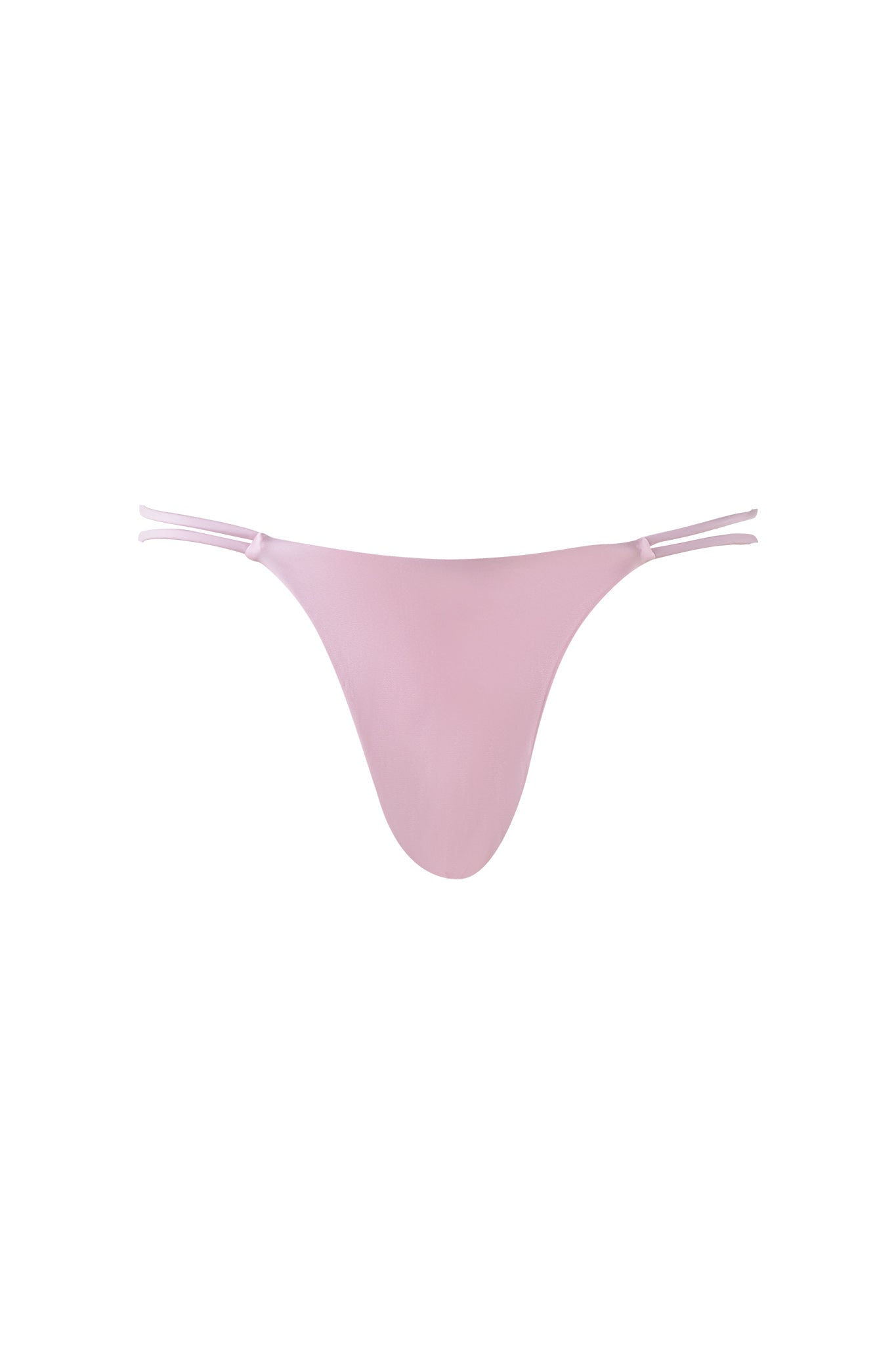 The PUKA BIKINI BOTTOM - PINK from I.AM.GIA features a minimalist design with a seamless front panel and double strap sides, presenting a sleek and elegant look. The pastel pink fabric appears smooth, offering a comfortable and barely-there feel against a plain white background.