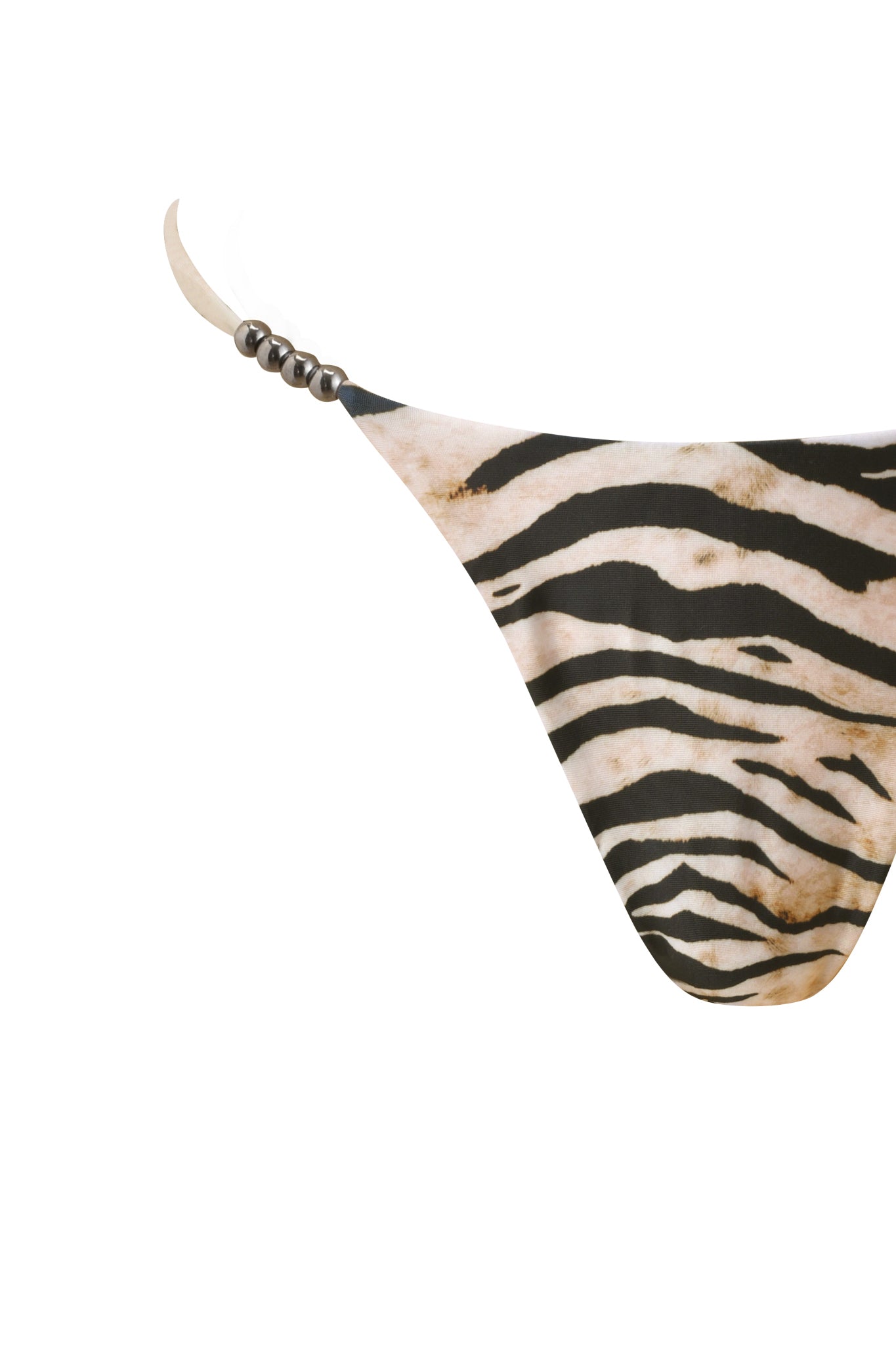 Close-up of the LUMANI BIKINI BOTTOM - WILD SIDE by I.AM.GIA, featuring a Brazilian cut, black and beige zebra print, and decorative metallic side beads. Shown against a plain white background.