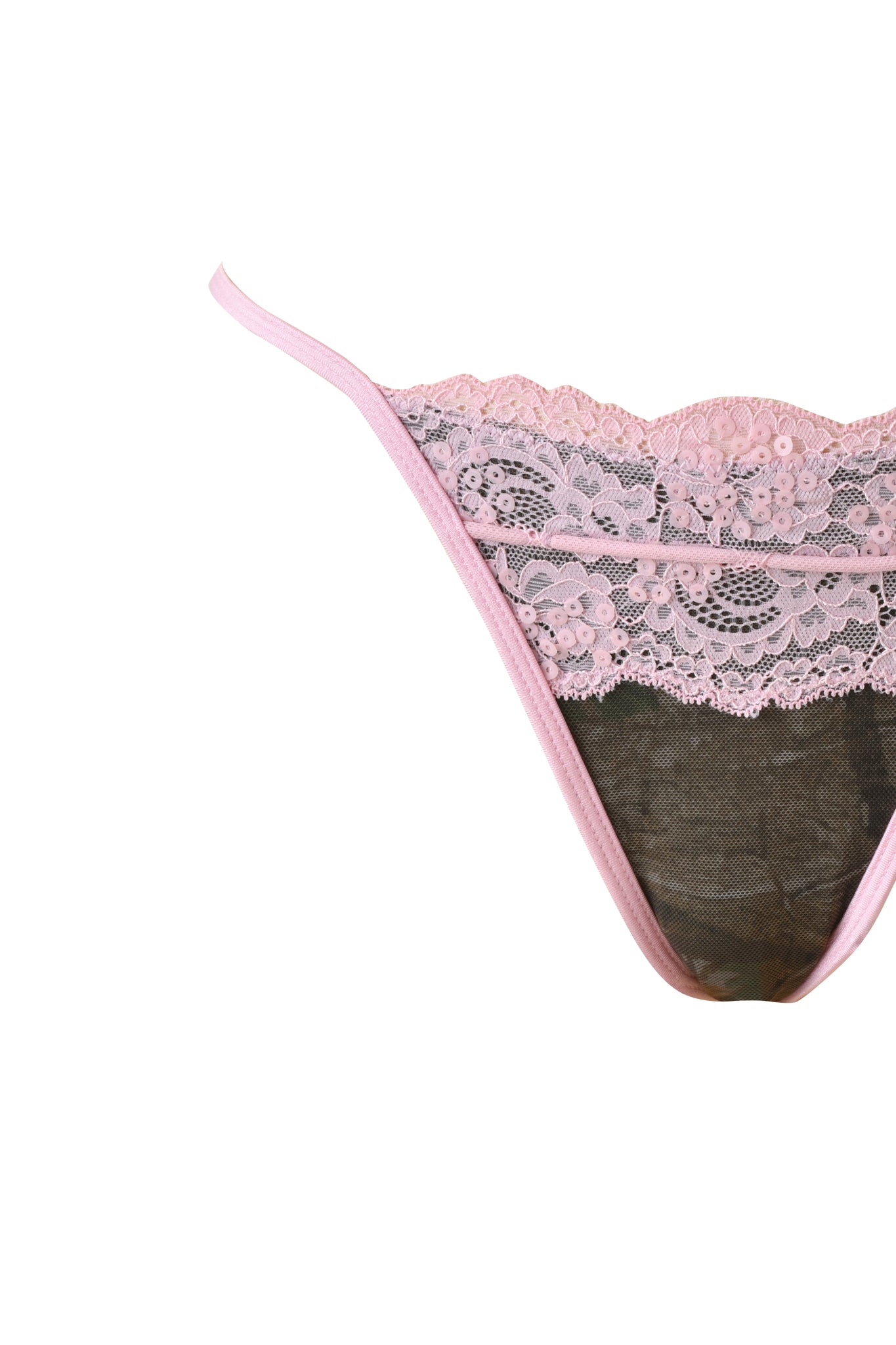 A close-up of the I.AM.GIA SAKINA BIKINI BOTTOM - BARK AND BITE CAMO, featuring sheer lace fabric, thin waistband straps, and a cheeky style, displayed against a white background.