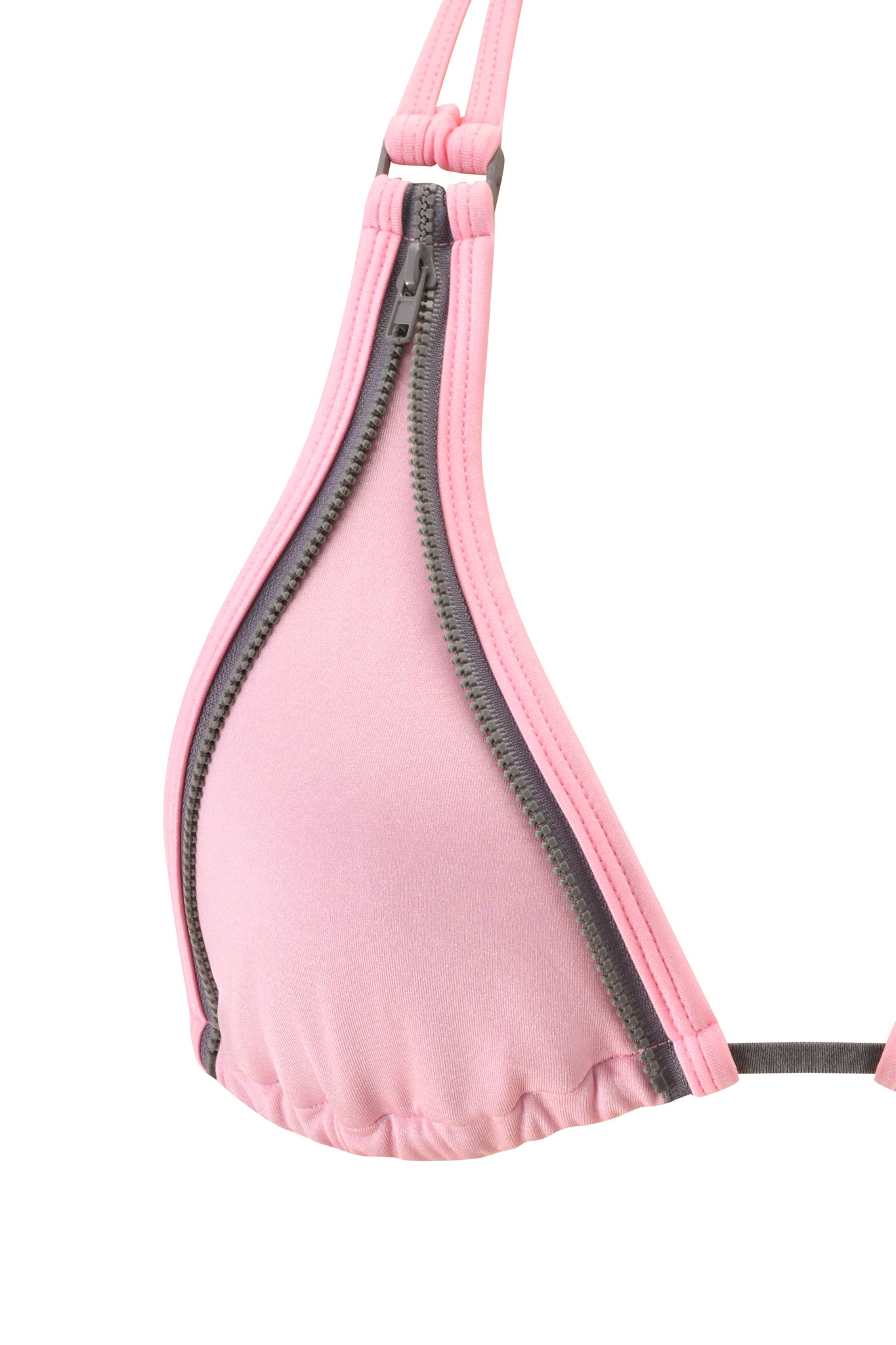 A close-up of the CAMERON BIKINI TOP - BABY PINK by I.AM.GIA, showcasing its classic triangle silhouette and mini gray zipper detailing that runs diagonally across the cup.