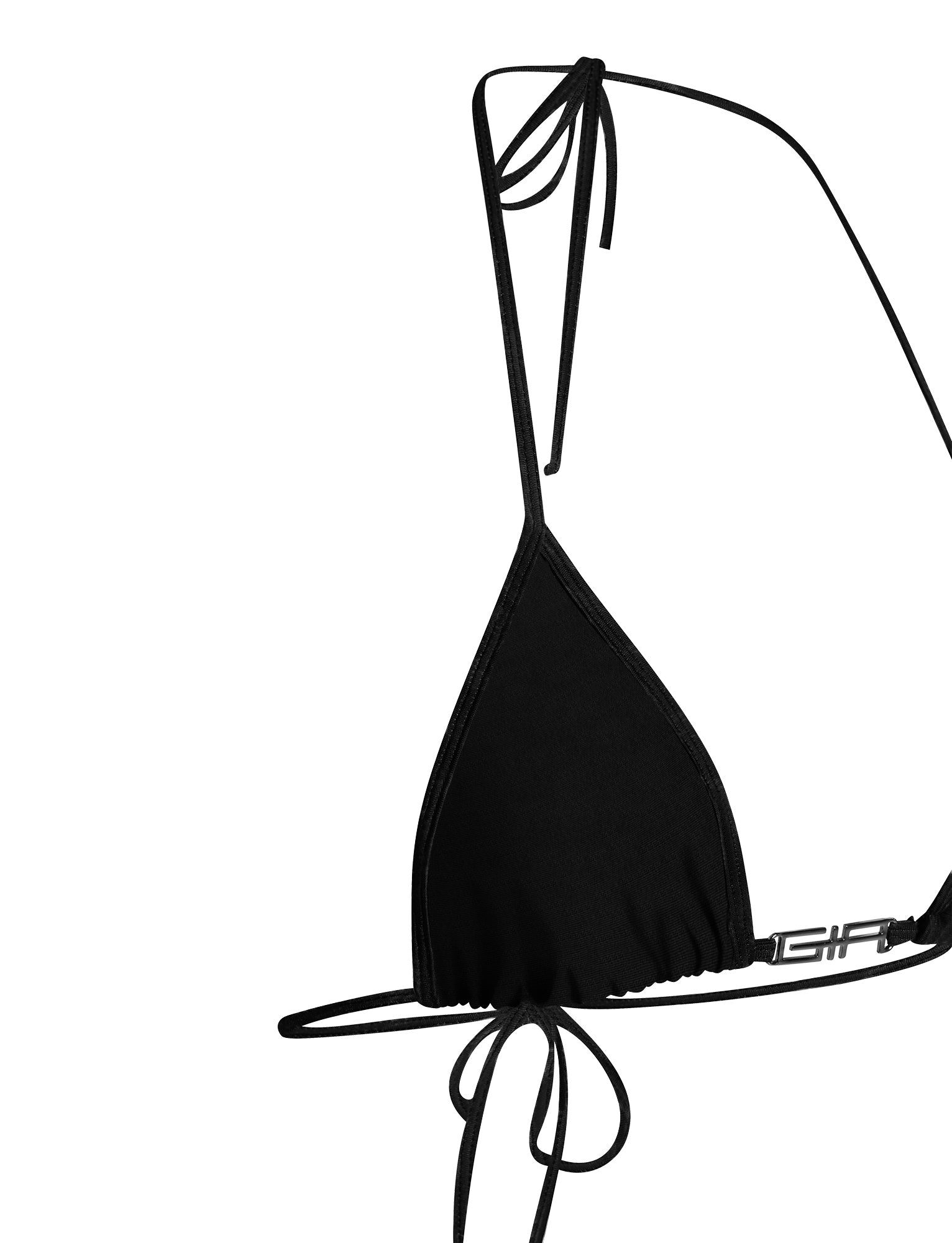 The AVA BIKINI TOP - SOLID BLACK by I.AM.GIA features a minimalist and sleek design with adjustable spaghetti straps that tie around the neck and back. The smooth fabric is complemented by a small metal clasp on the left side of the band.