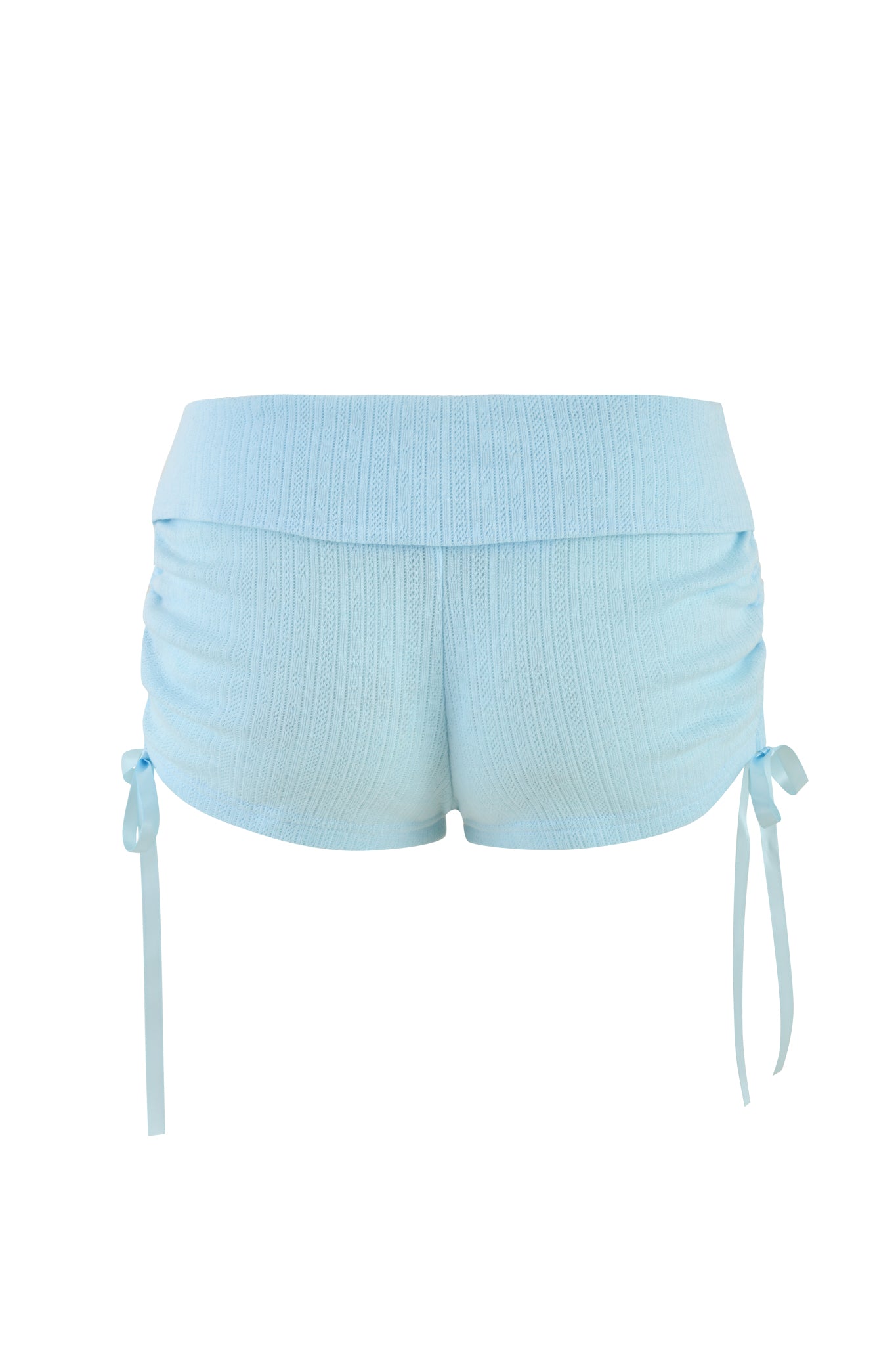 Introducing the MIA SHORT - BLUE : BABY BLUE by I.AM.GIA, featuring a light baby blue ribbed texture with stylish side ruching and matching blue ribbon ties. Designed with a low-rise elastic waistband, these shorts provide a comfortable and casual look.