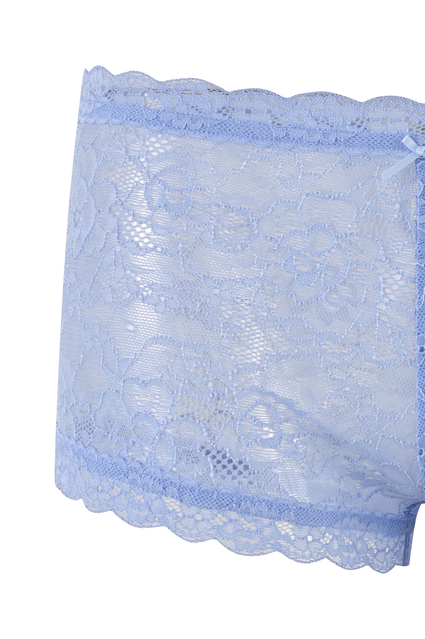 Close-up of a section of the SERINA SHORT - BLUE : LACE by I.AM.GIA, featuring light blue stretch lace fabric with a floral pattern. The fabric edge has a scalloped trim, adding to its delicate and intricate design, perfect for creating a bodycon silhouette.
