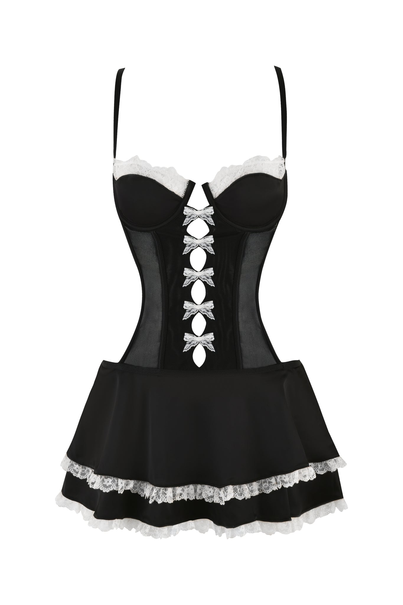 The JULIETTE SLIP DRESS - BLACK by I.AM.GIA is a black French Maid-inspired mini dress adorned with white lace accents. It features a corset-style design with a slightly sheer mesh bodice, crisscrossed white ribbons down the front, and a flowy black skirt trimmed with white lace at the hem. The dress is completed with delicate thin shoulder straps.