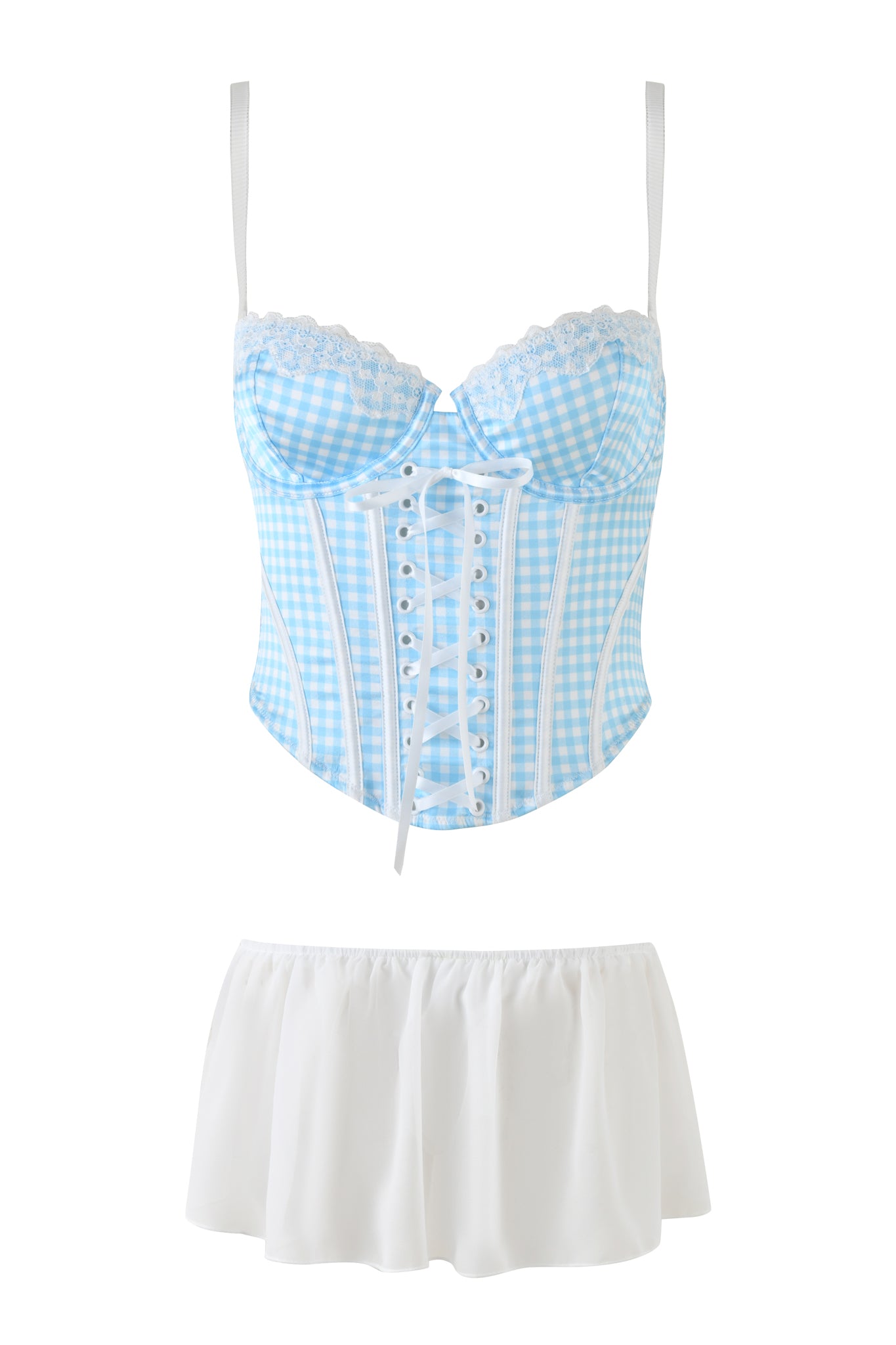 The JENNY BUSTIER SET - BLUE : CHECK : GINGHAM from I.AM.GIA includes a blue and white gingham bustier with lace trim and a short white skirt. The bustier features a front lace-up design, thin straps, and a sweetheart neckline, capturing a classic, Dorothy-inspired lingerie look. Complemented by the simple, flowing design of the airy skirt, this set is perfect for Wizard of Oz fantasies.