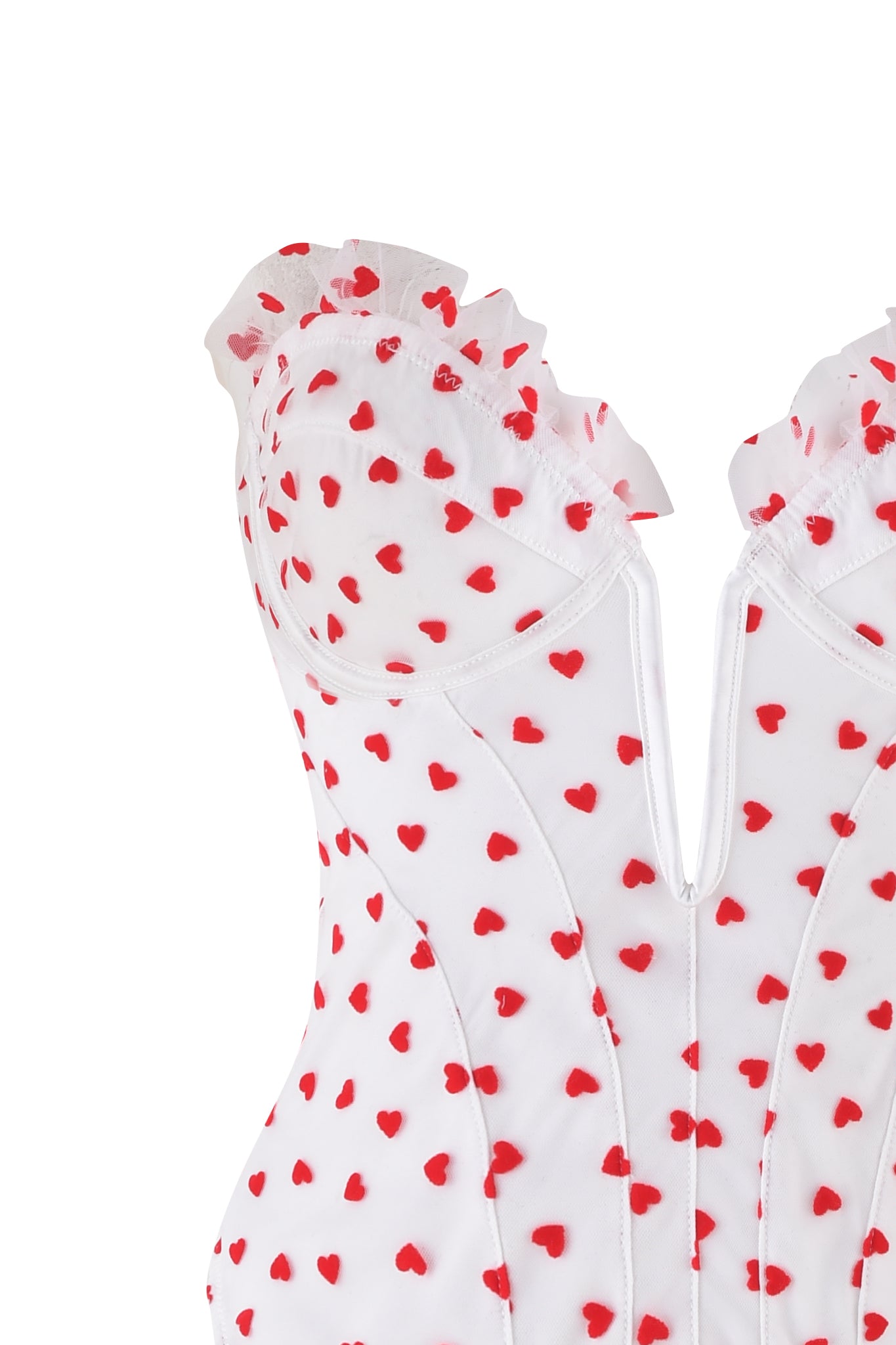 The PAMELA SET - WHITE : HEARTBEAT by I.AM.GIA features a vintage-inspired white corset with red heart patterns, made from heart flocked tulle and ruffled trim. It has sheer fabric, structured seams, a zip closure, and removable garter straps for versatility.