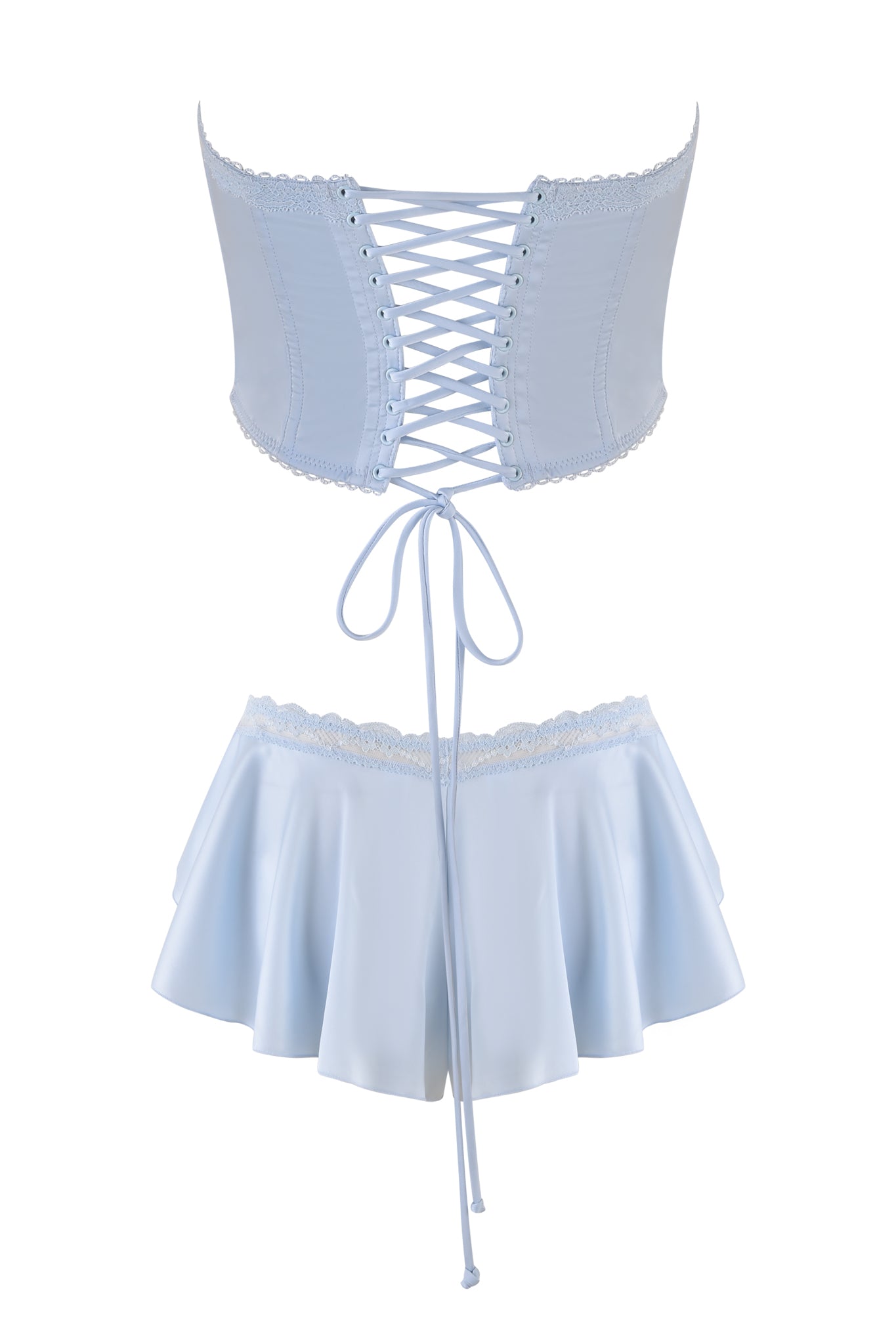 The BRIDGET BUSTIER SHORT SET - BLUE from I.AM.GIA includes a light blue corset-style top with a vintage-inspired bustier and lace-up back, plus a flowing mini skirt. Both pieces feature stretch lace trims for an elegant, feminine look.