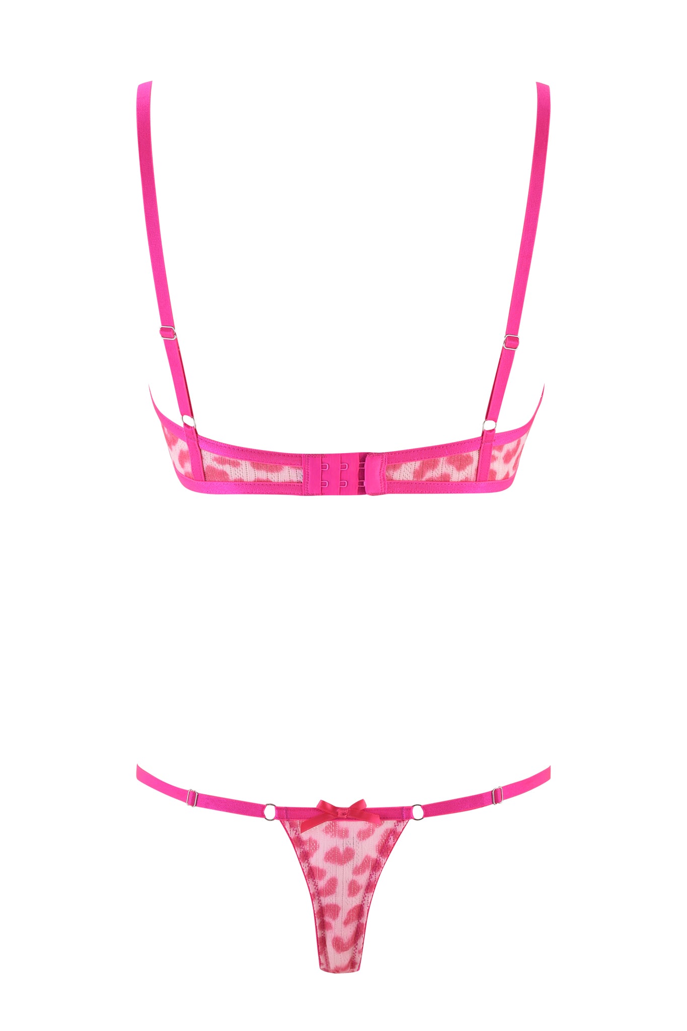 The SKYE SET 2.0 - PINK by I.AM.GIA showcases a pink leopard lace lingerie ensemble. The bra is equipped with thin adjustable straps, and the thong highlights a charming bow detail at the front, adding an element of playful elegance.