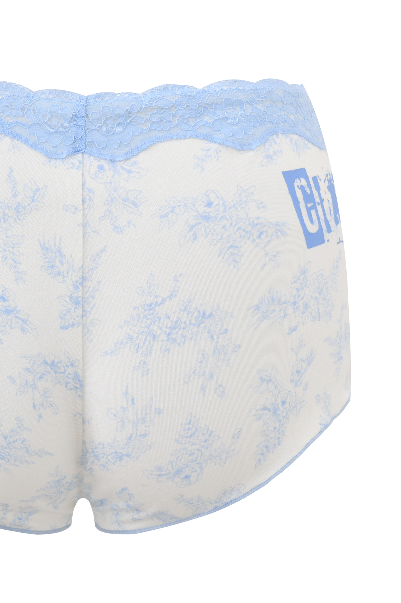 The CASSIA SHORT - BLUE TOILE by I.AM.GIA is light-colored bamboo underwear featuring a delicate blue toile floral print, blue lace trim at the waistband, and partial blue text on the right side.