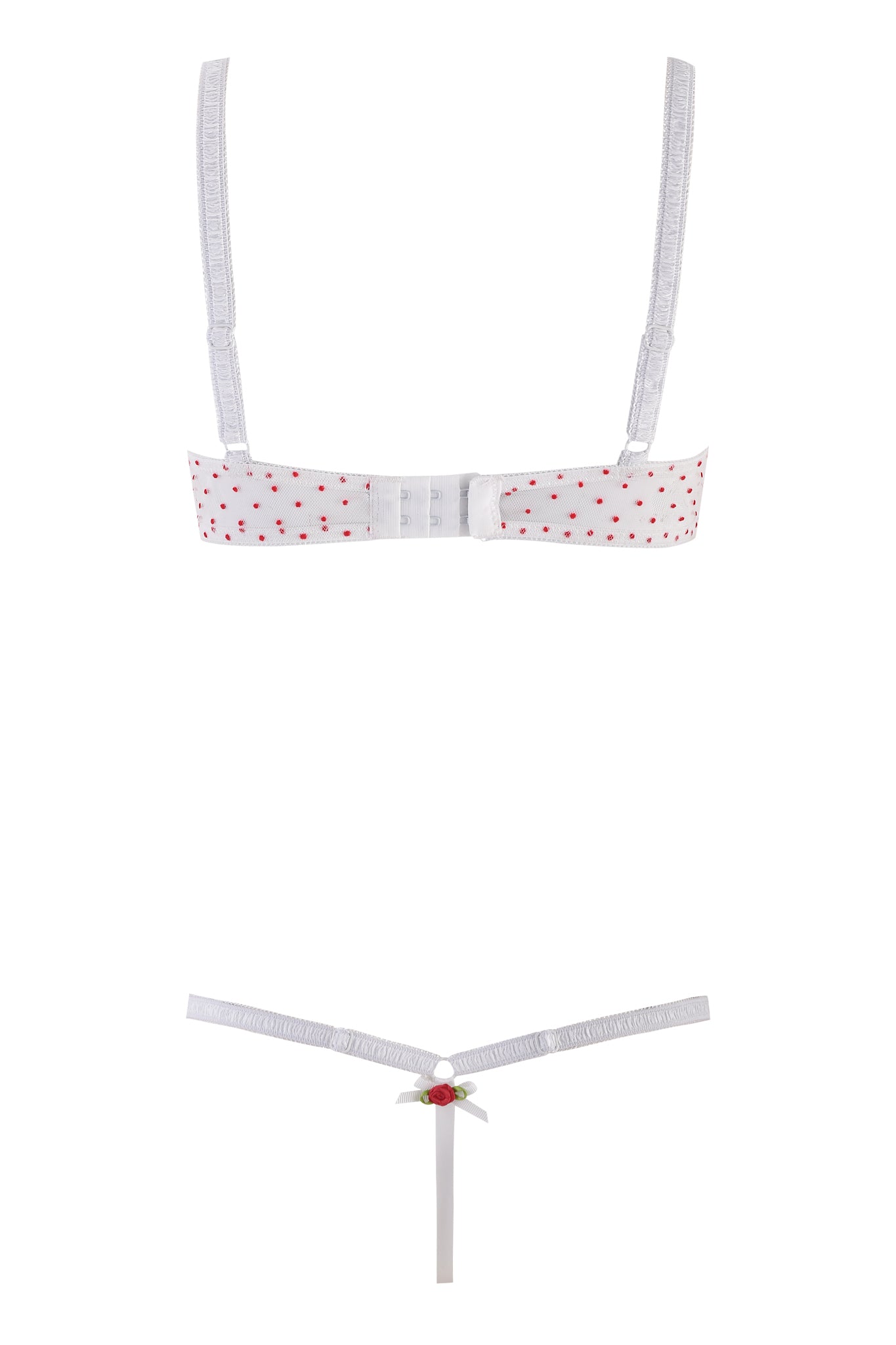 The CHRISSY SET - WHITE by I.AM.GIA features a white lingerie set with red polka dots. The underwire bra has adjustable straps and clasp closure, while the matching thong is adorned with a small red bow and green accent at the center.