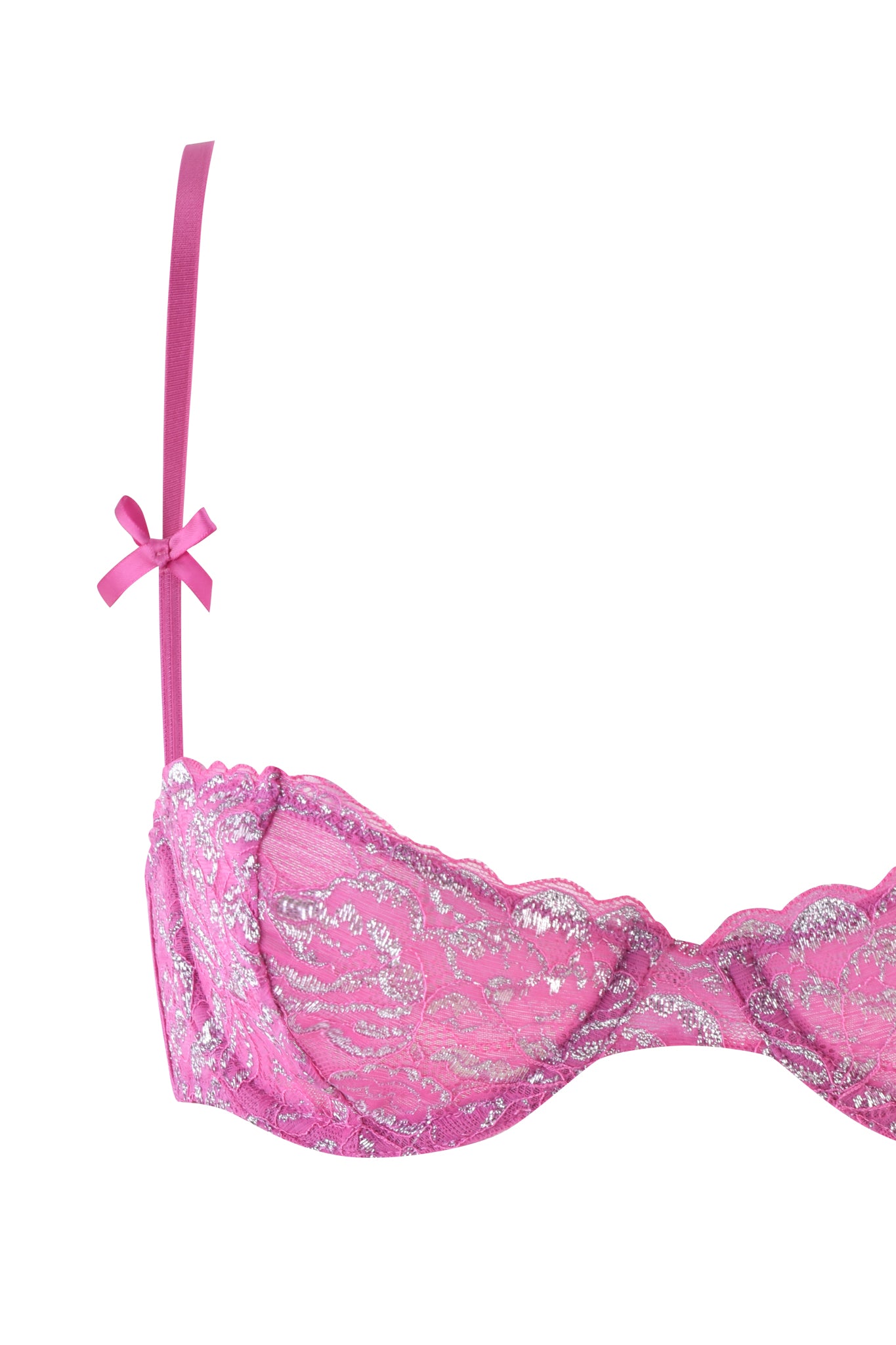 The RAINE 3 PIECE METALLIC SET - PINK by I.AM.GIA presents a Y2K-inspired pink lace bra with silver floral patterns and a dainty bow on the left strap. Made from stretch lace, it combines elegance and comfort, with the right side partially visible to enhance its delicate appeal.