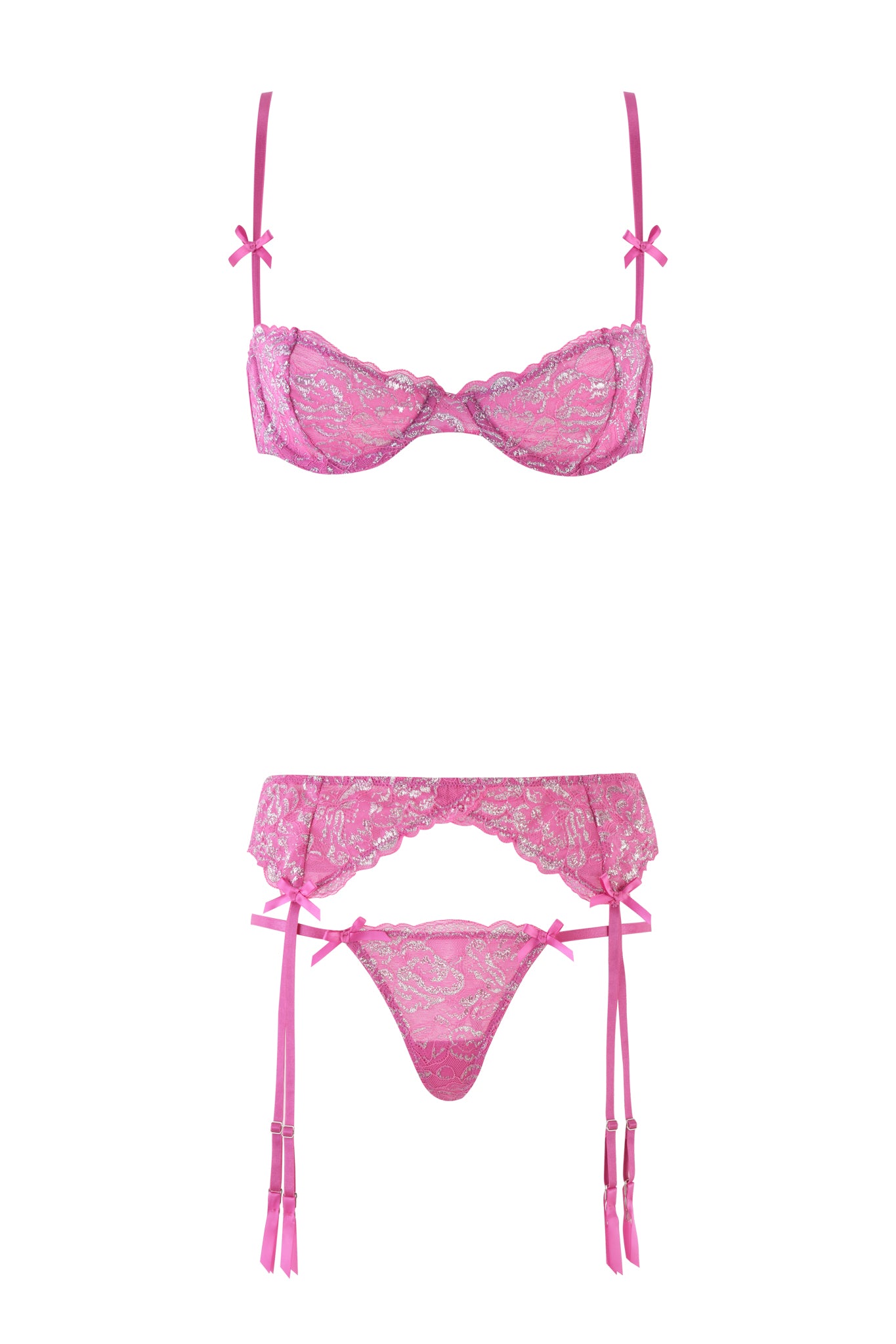 The RAINE 3 PIECE METALLIC SET - PINK by I.AM.GIA is a Y2K-inspired lingerie set featuring a bra, garter belt, and thong with stretch lace, bow accents, and sheer floral patterns.