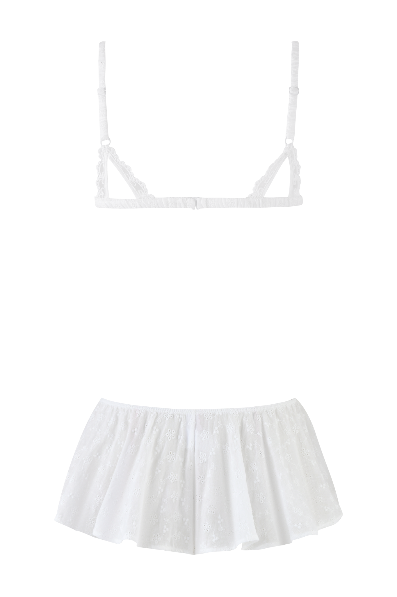 The JUNIE SHORT SET - WHITE by I.AM.GIA features a white sleeveless camisole with thin adjustable straps, a fitted bodice, flared ruffled hem, and delicate embroidered eyelet with subtle floral details.