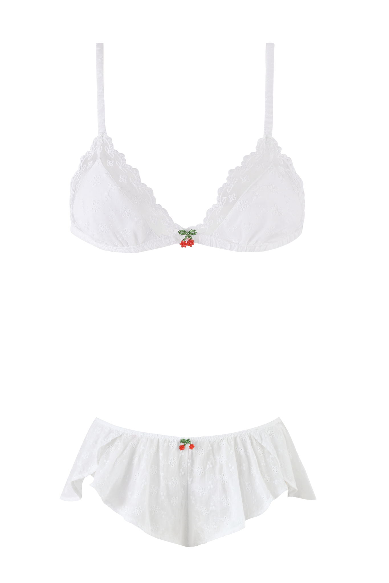The JUNIE SHORT SET in white by I.AM.GIA is a delicate lingerie set with thin straps, lace details, and both the bralette and skirt featuring embroidered eyelet accents and beaded cherry embellishments at the center.