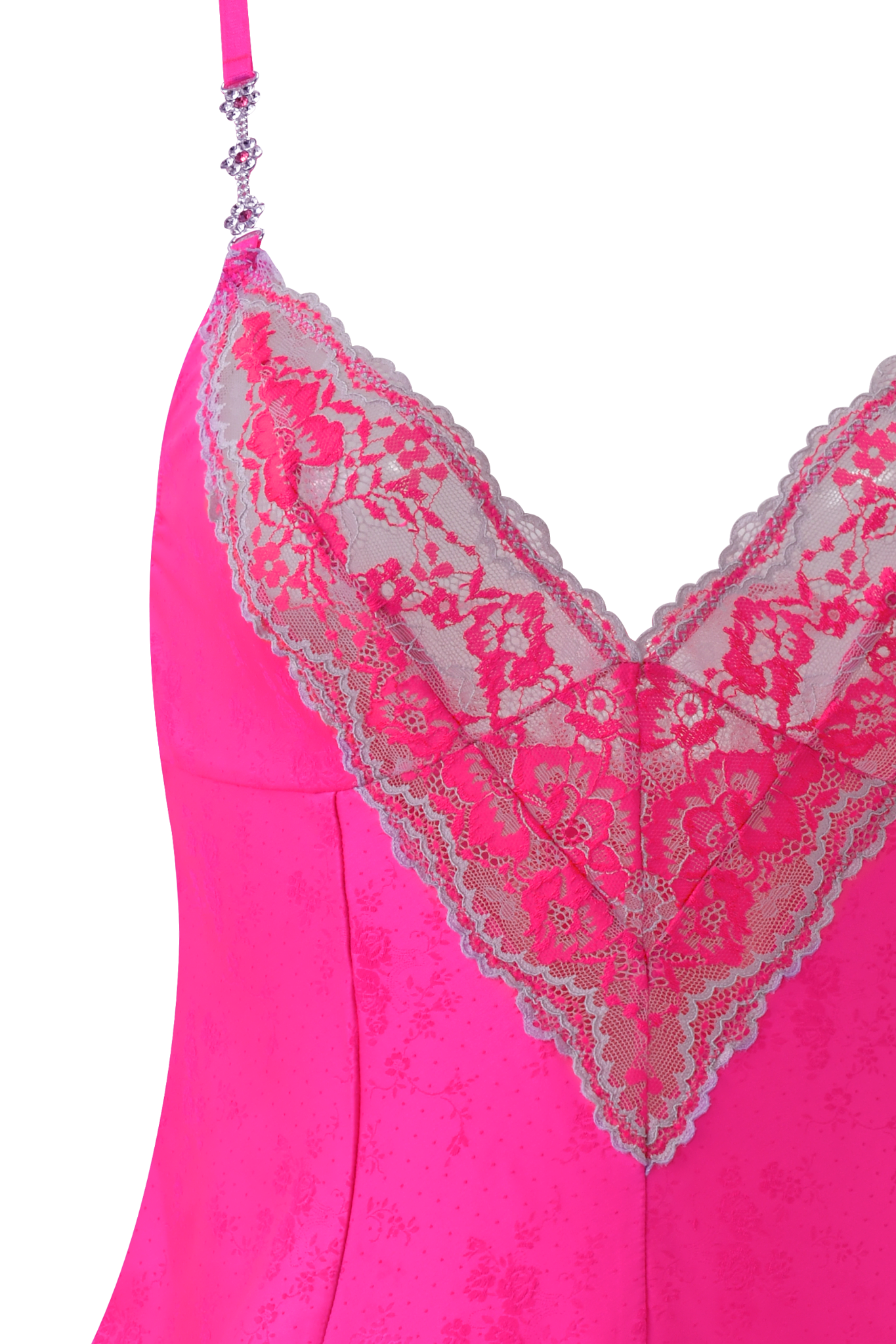 Close-up of the I.AM.GIA AMAYA CAMI SET in neon pink, featuring adjustable straps and a deep V-neckline detailed with delicate neon floral lace trim along the bust and neckline.