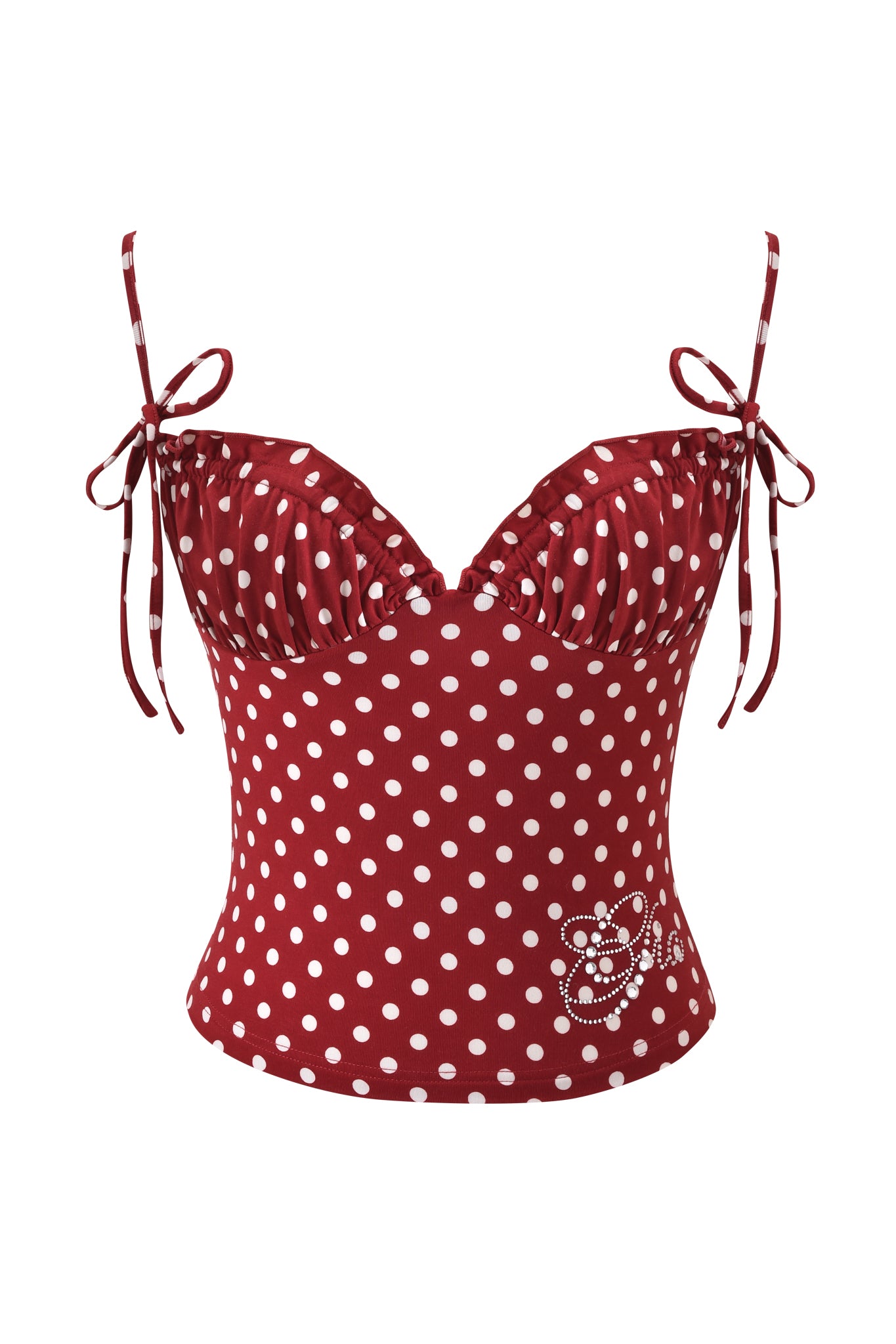 The MELANIE CAMI - RED POLKA DOT by I.AM.GIA features a bodycon fit, adjustable bow-tied straps, ruched bust, and a rhinestone cat accent near the hem.