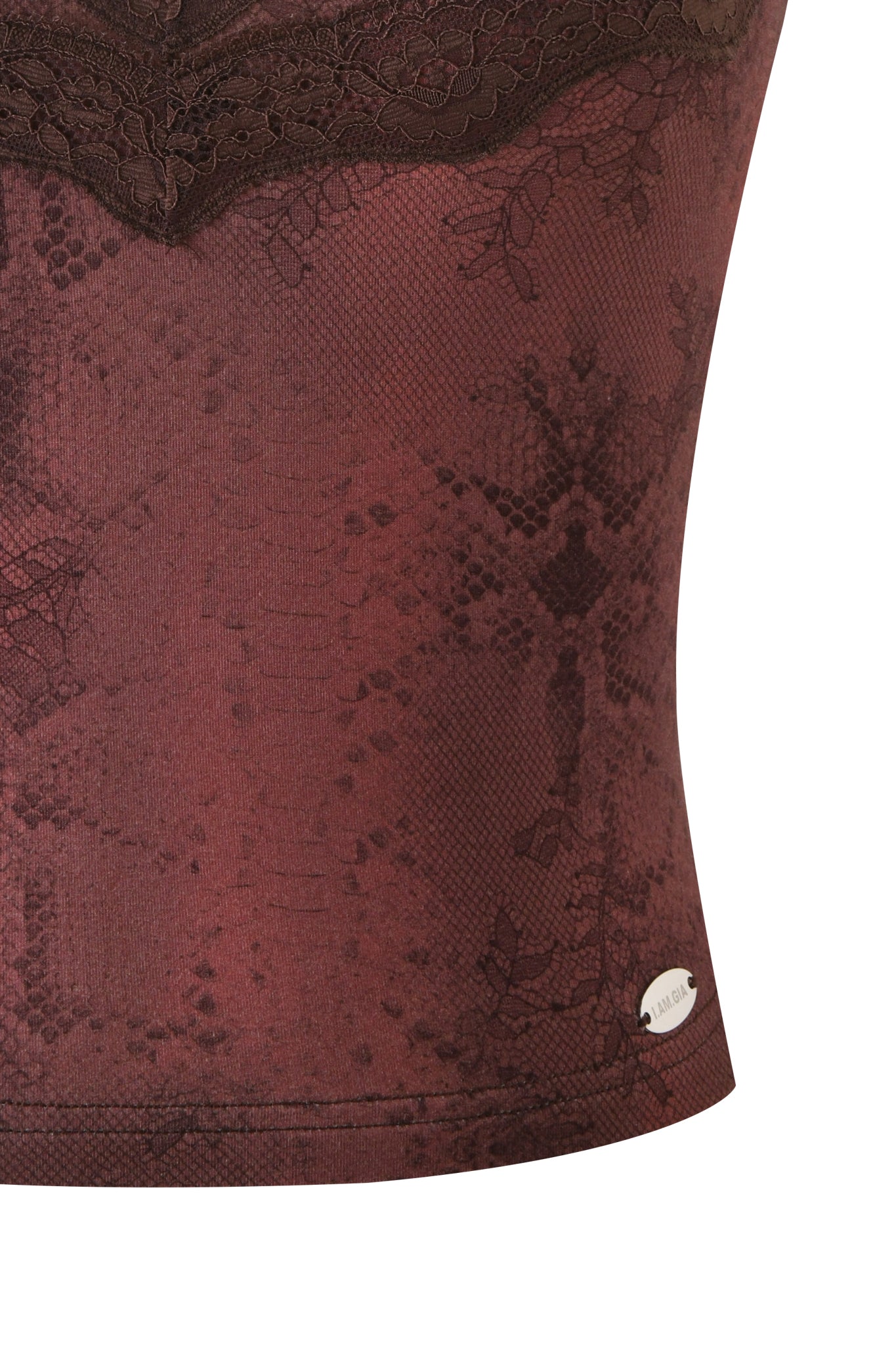 Close-up of the BEAU TOP in brown by I.AM.GIA, featuring maroon lace-patterned fabric, dark lace trim at the top, and a small oval metallic tag near the bottom hem.