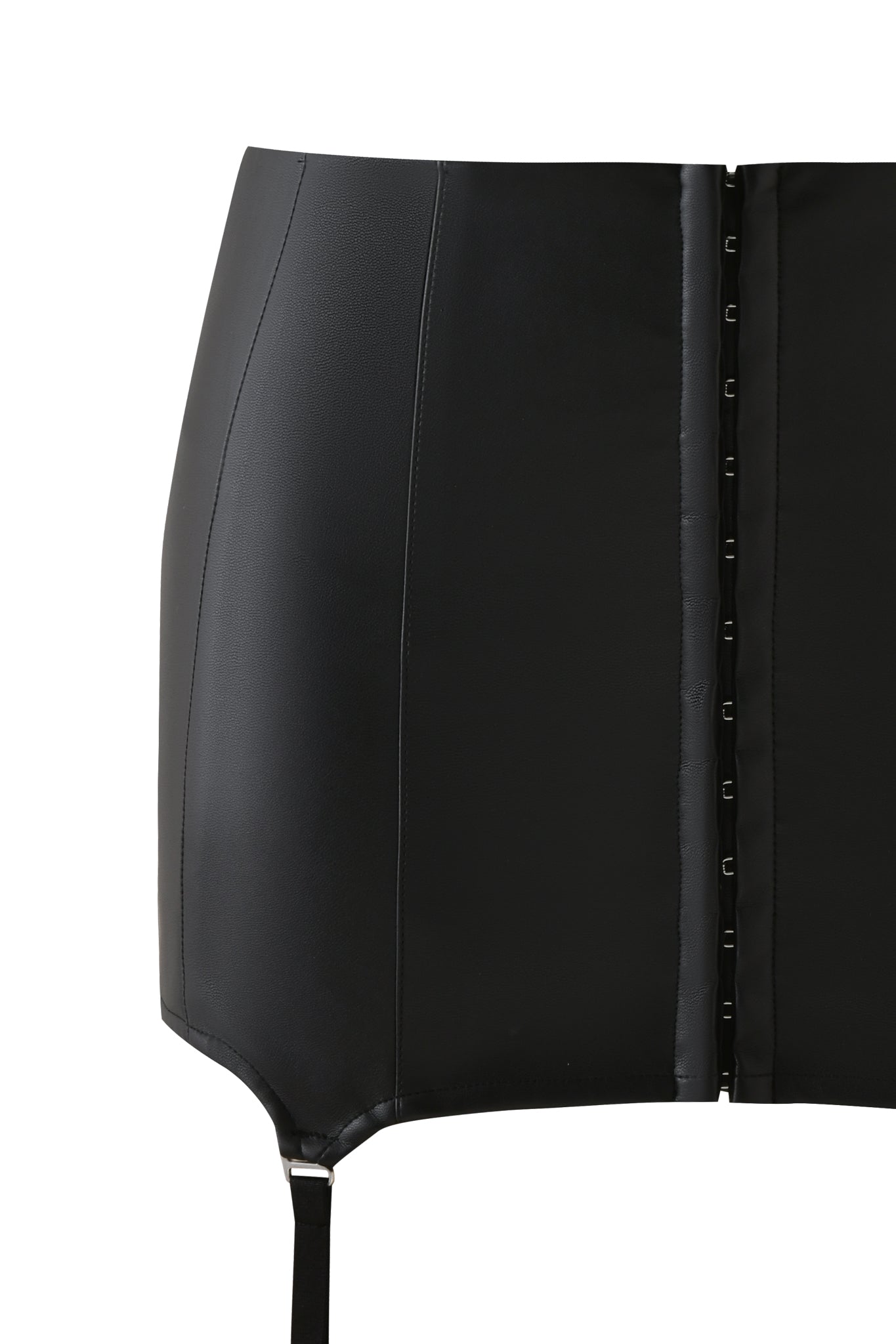 A close-up of the SIBARI MINI SKIRT - BLACK by I.AM.GIA, featuring vertical seams, hook-and-eye front closures, and a single adjustable strap for a chic garter-style look.