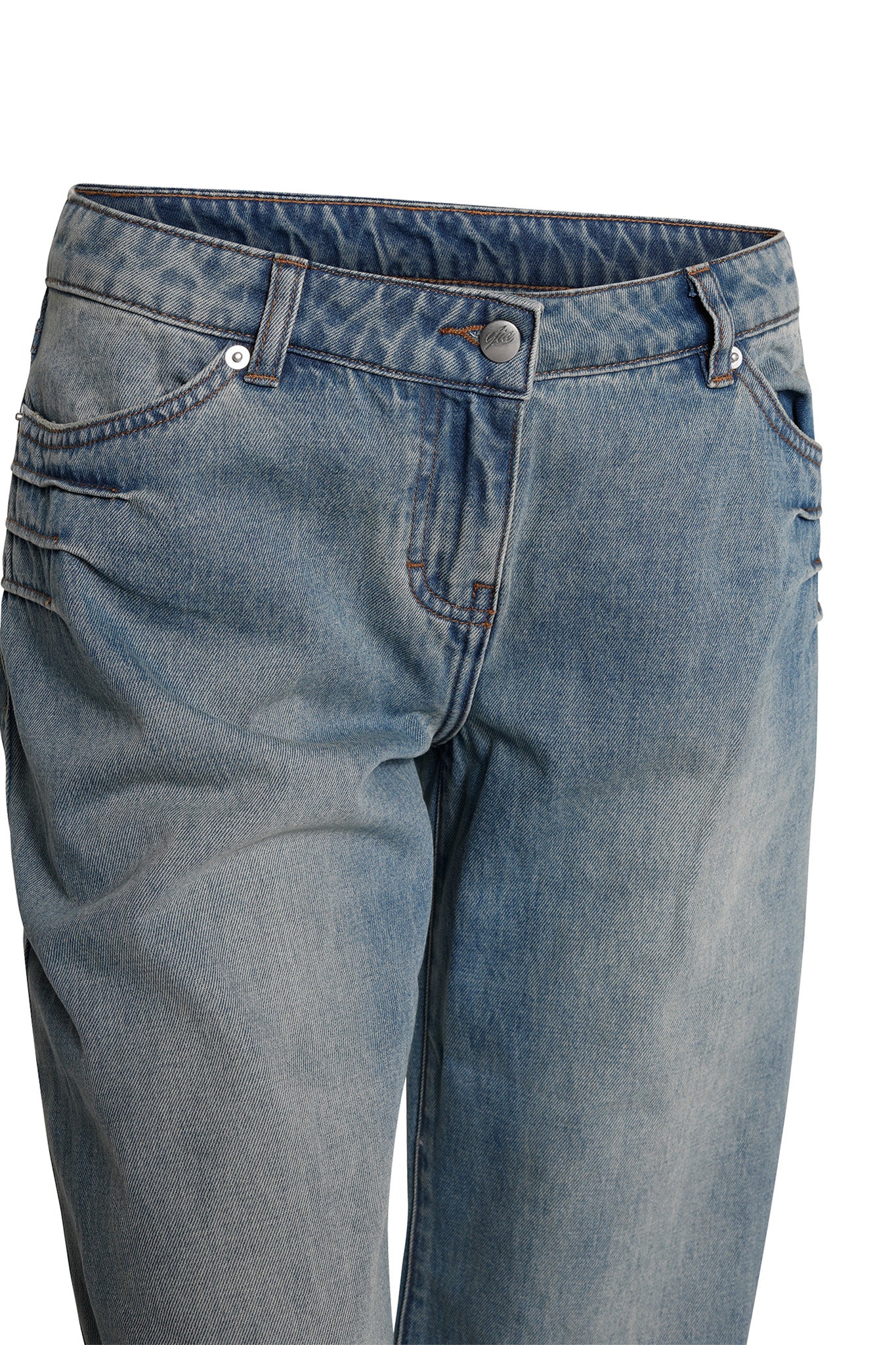 The DYLAN JEAN in Light Blue by I.AM.GIA is a pair of blue denim jeans with a slightly worn look. These jeans feature front pockets secured with rivets, belt loops, and a button and zipper closure. The fabric shows some wrinkling near the pockets and thighs, indicating light use.