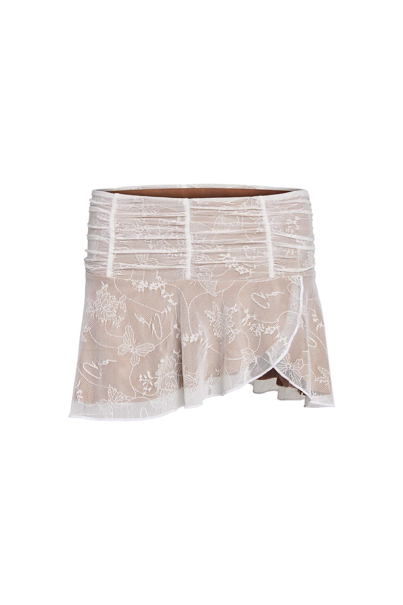 The YVETTE SKIRT - WHITE : BUTTERFLY LACE by I.AM.GIA is a beige mini skirt adorned with a white butterfly lace overlay. This mini-length skirt features a ruched waistband and an asymmetrical hemline, adding a stylish touch to the design.