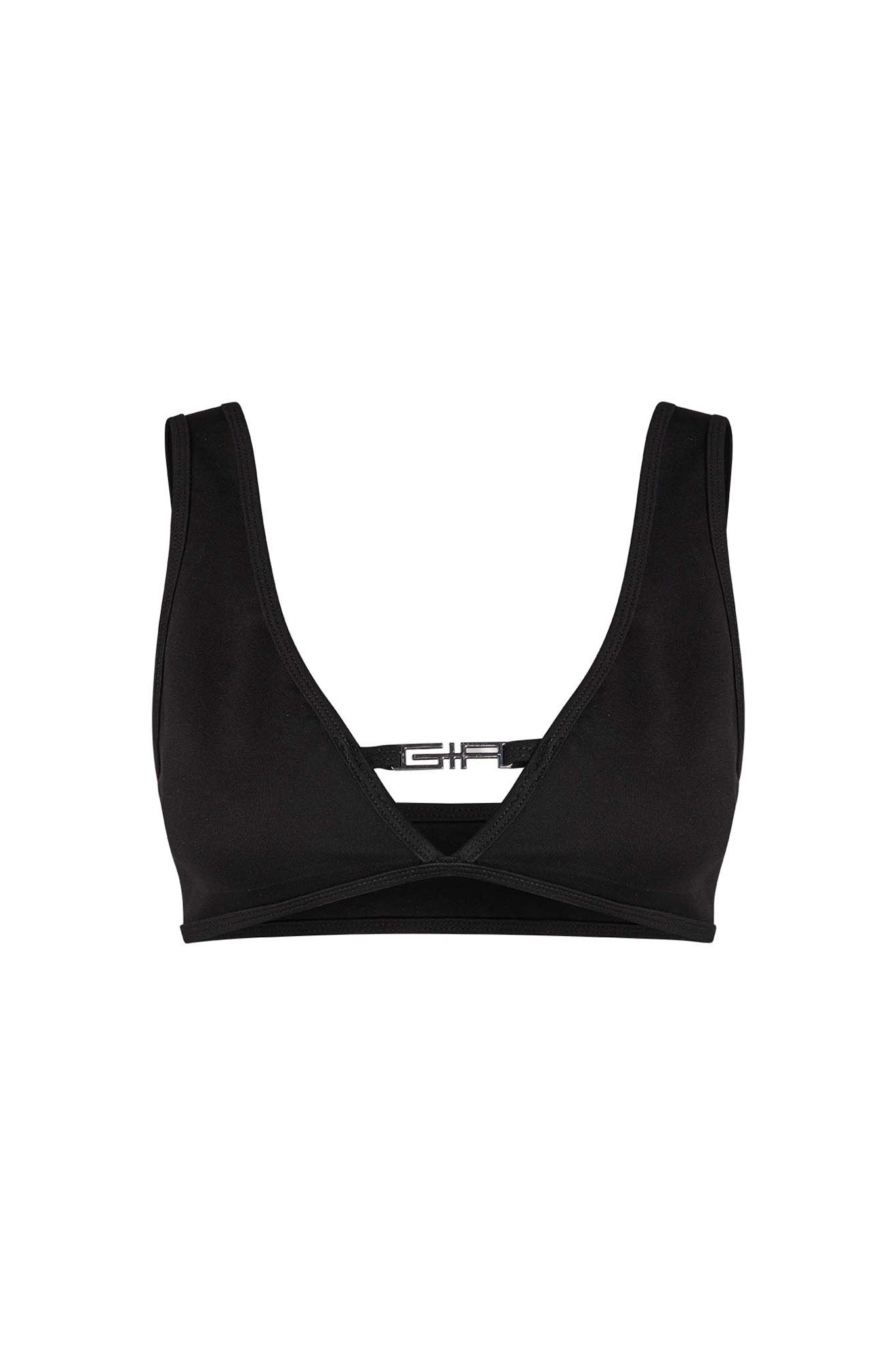 The LUCID TOP - BLACK by I.AM.GIA is a sports bra featuring a deep V-neckline and wide shoulder straps. The back showcases a single horizontal strap connecting the two shoulder straps and an open cut-out design. The material is smooth and stretchy, perfectly capturing the edgy style that defines I.AM.GIA.